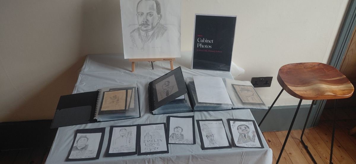Table of cabinet cards in display books at the exhibition